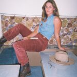 A copywriter sits on the desk of an RV table.