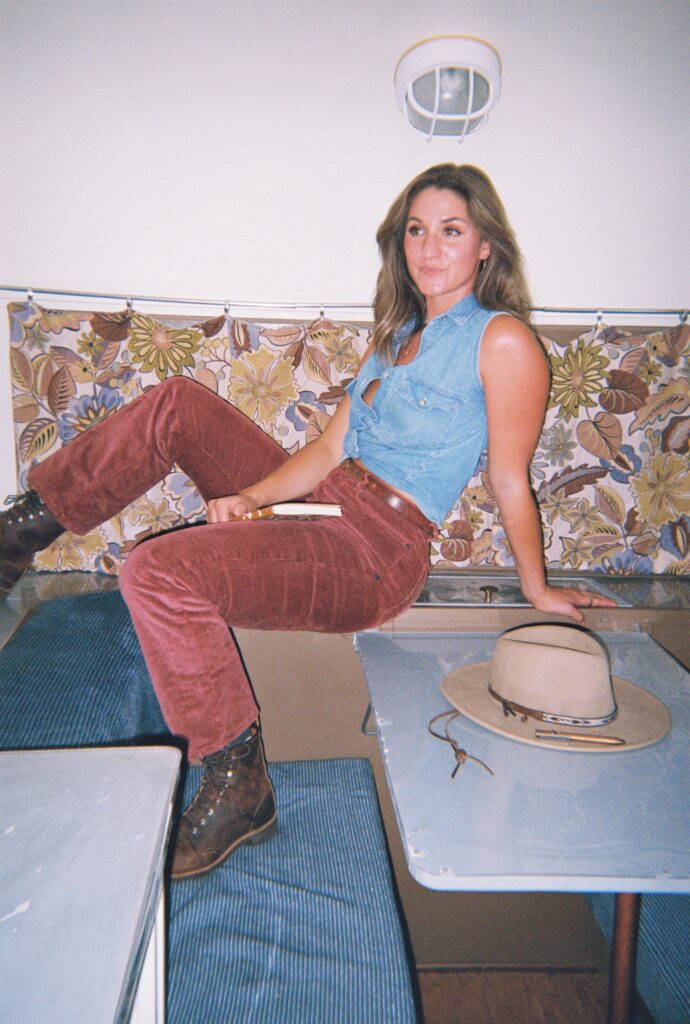 A copywriter sits on the desk of an RV table.